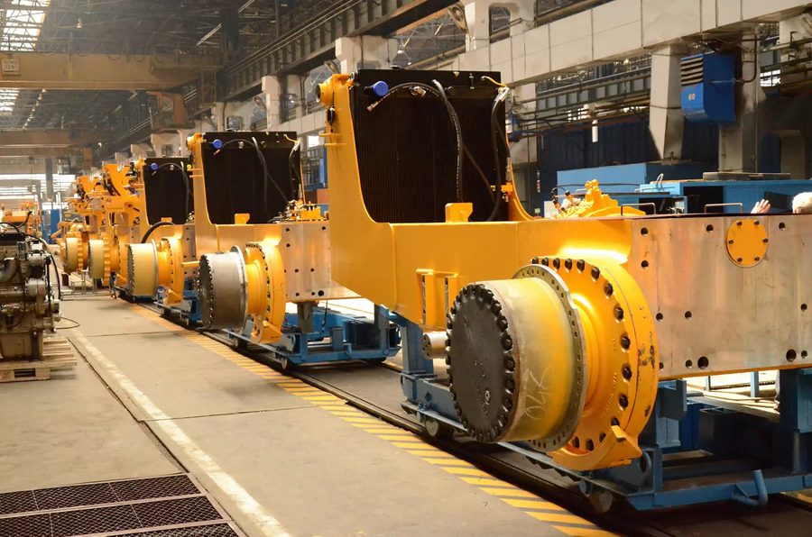 Row of heavy machinery frames on an industrial production line